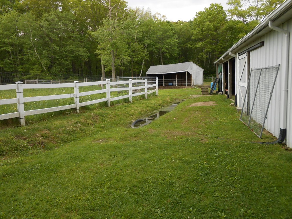 41 Corbin Road Dudley, MA 01571 - Photo 27 of 29 a house view with a garden space