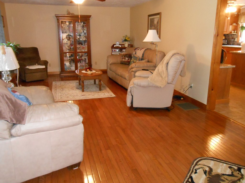 41 Corbin Road Dudley, MA 01571 - Photo 8 of 29 a living room with furniture and a flat screen tv