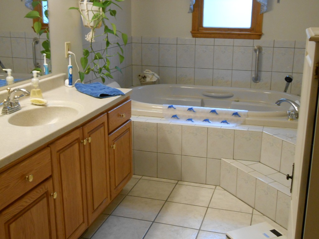 41 Corbin Road Dudley, MA 01571 - Photo 10 of 29 a bathroom with a sink and a bathtub