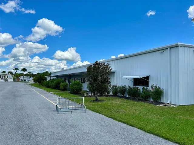 a view of a chair and table in the garden