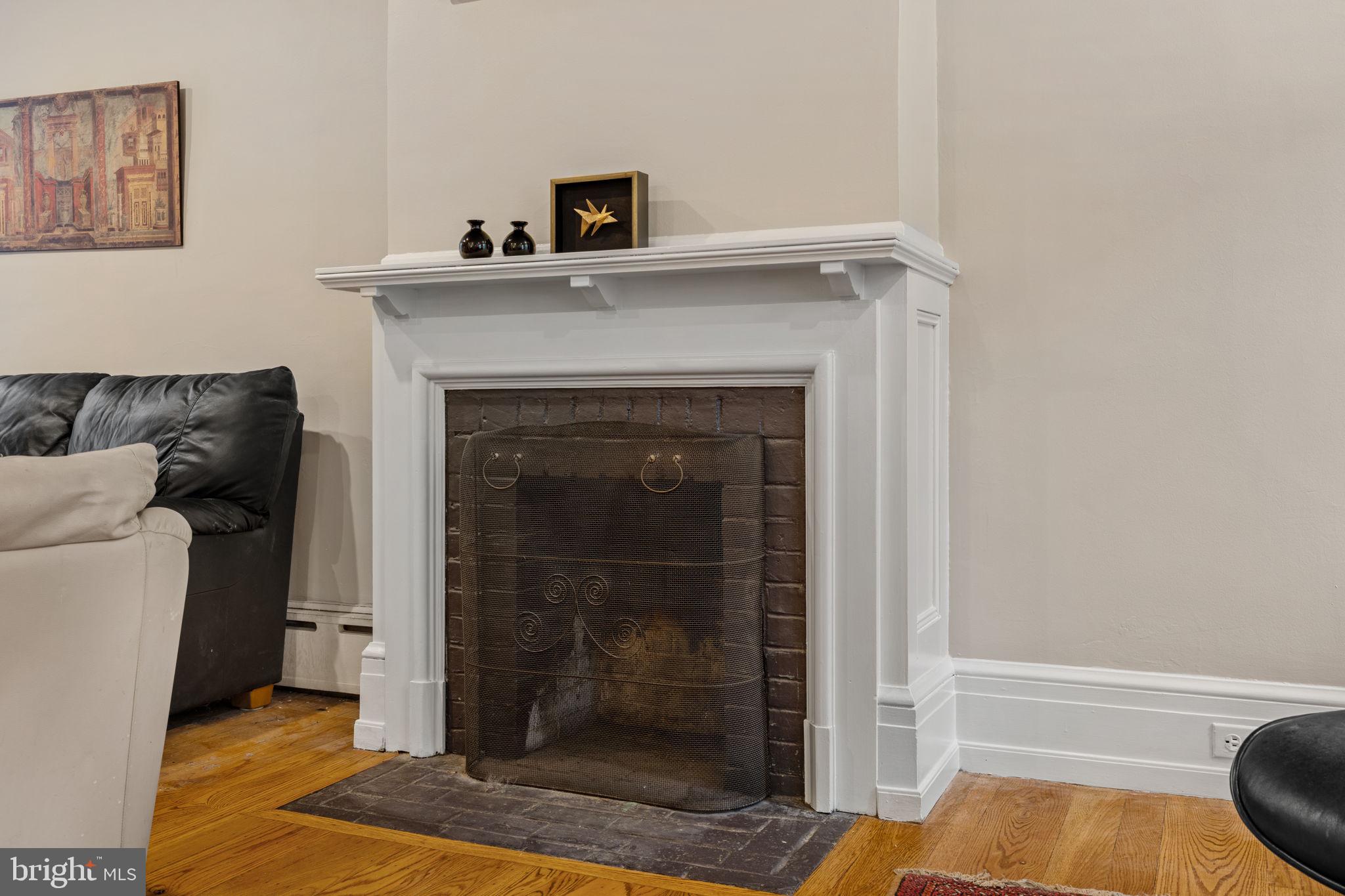 2208 Rittenhouse Square Philadelphia, PA 19103 - Photo 6 of 27 a living room with furniture and a fireplace