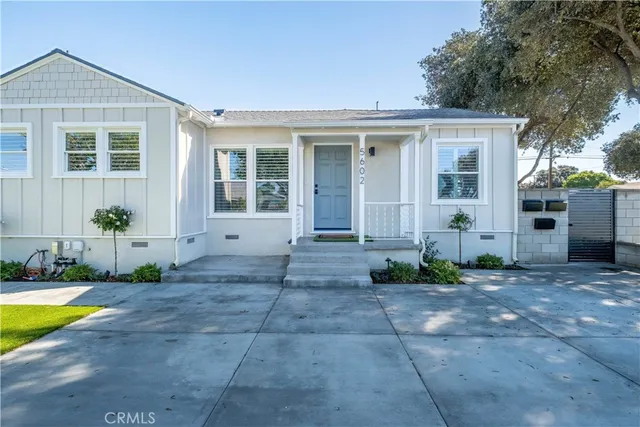a view of a house with swimming pool in front of it