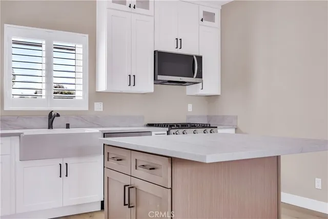 a bathroom with a granite countertop sink mirror and double