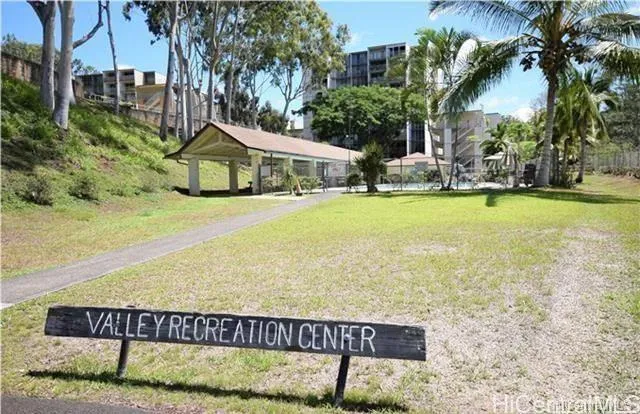 a view of a street with a building in the background
