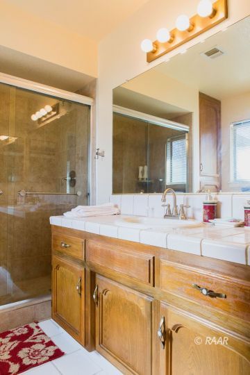 204 North Broadway Street Ridgecrest, CA 93555 - Photo 18 of 29 a bathroom with a sink and a mirror