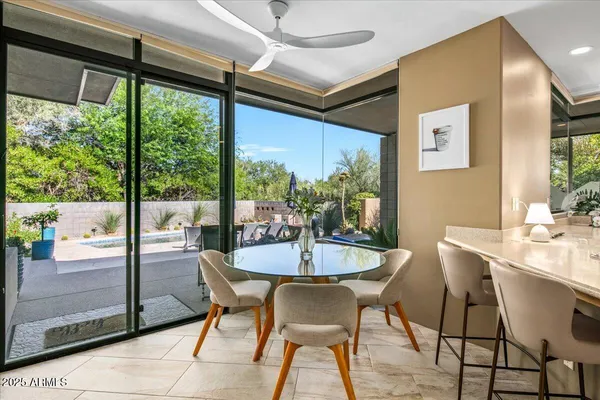 a dining room with furniture and window