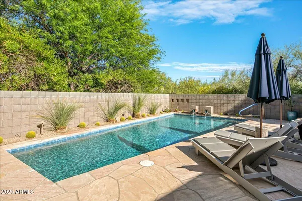 a view of a backyard with sitting area