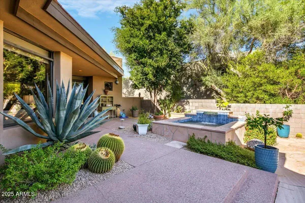 a view of a backyard with sitting area