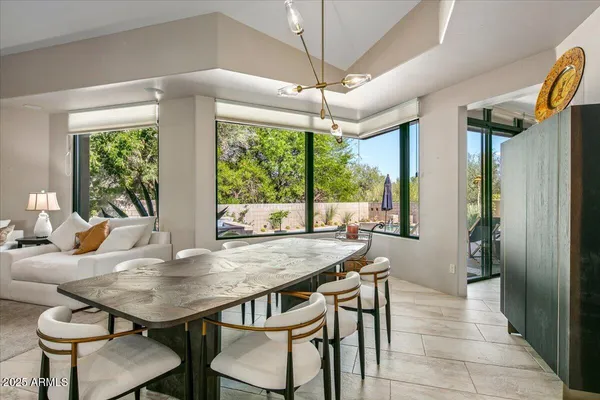 a view of a dining room with furniture window and outside view