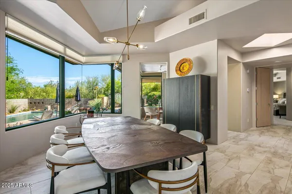 a view of a dining room with furniture window and outside view