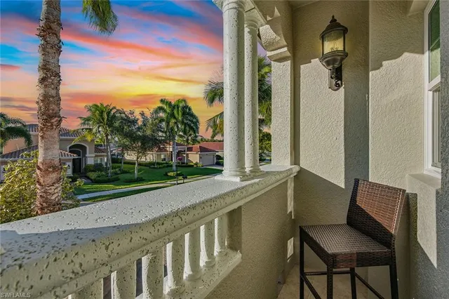 a view of a chair and table in the patio