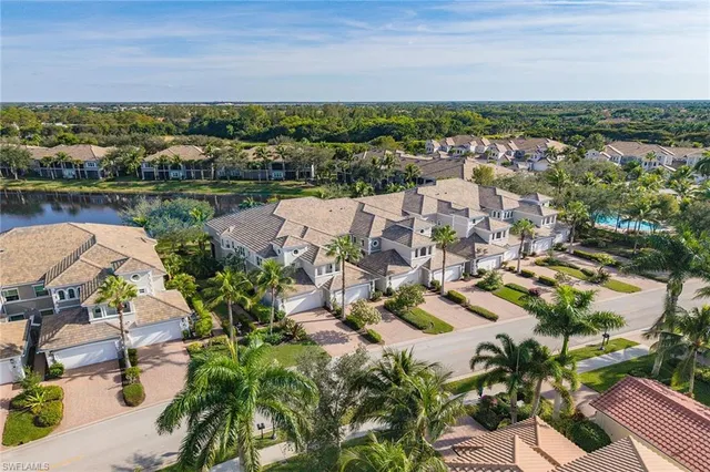 an aerial view of a city with ocean view