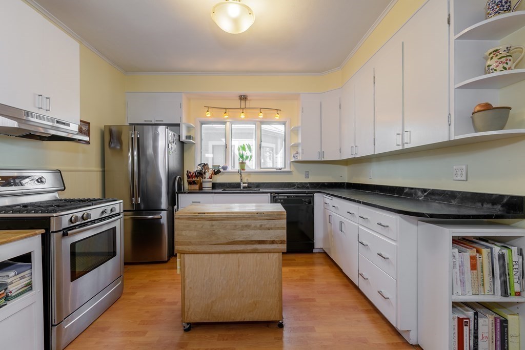 181 Willow Avenue Somerville, MA 02144 - Photo 13 of 31 a kitchen with appliances cabinets and a window