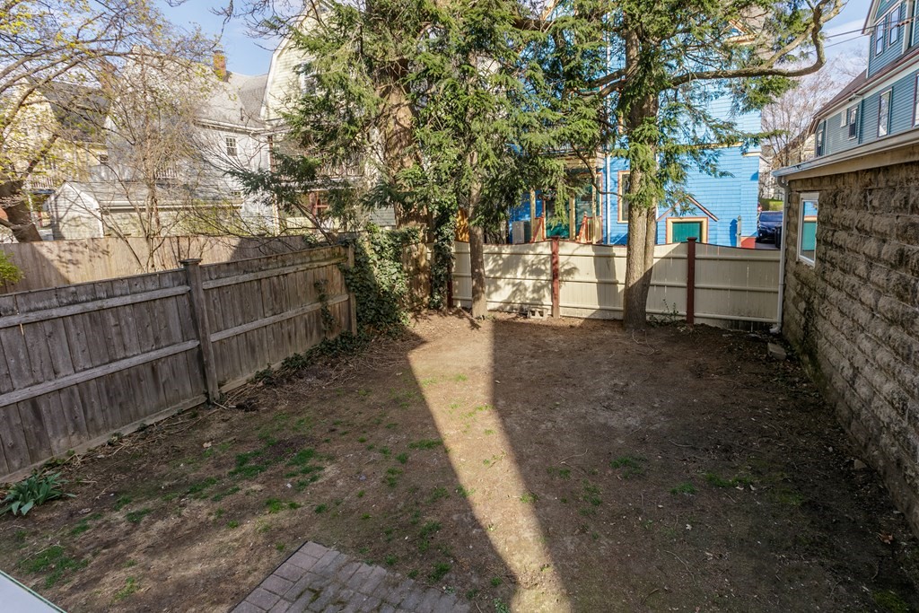 181 Willow Avenue Somerville, MA 02144 - Photo 27 of 31 a view of a yard with plants and trees