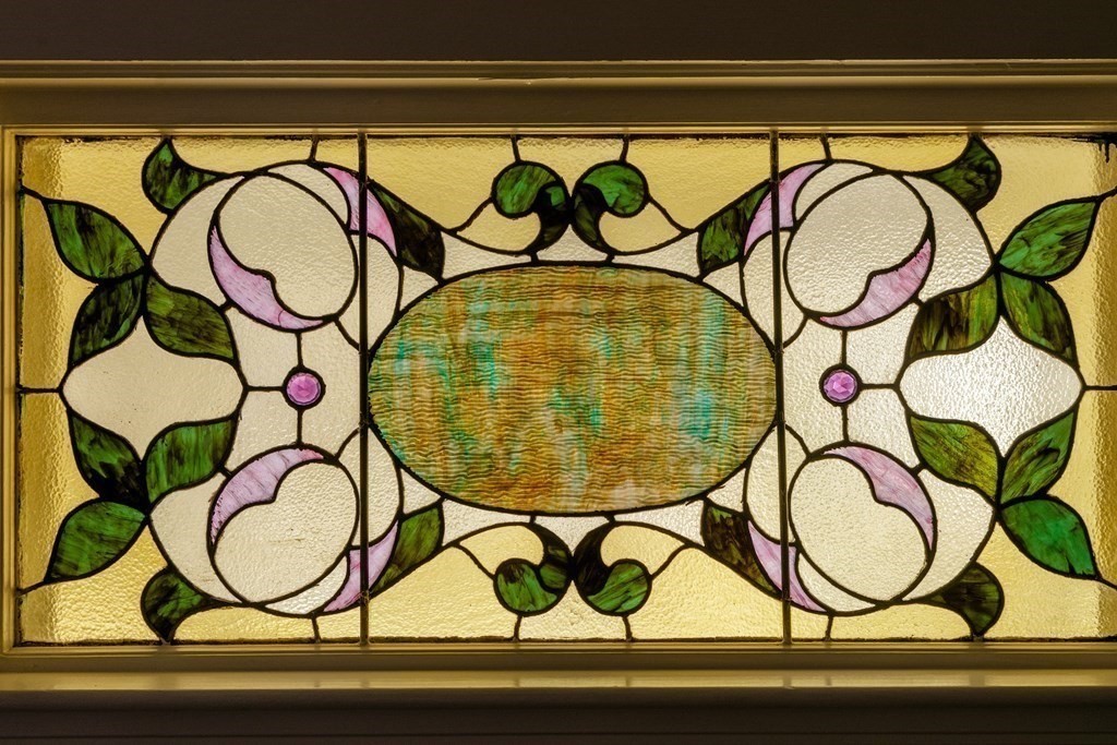 181 Willow Avenue Somerville, MA 02144 - Photo 5 of 31 a view of a bench with an next to a window