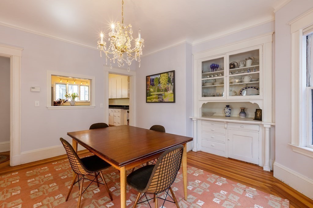 181 Willow Avenue Somerville, MA 02144 - Photo 10 of 31 a view of a dining room with furniture and chandelier