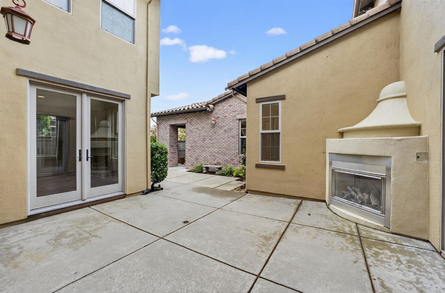 2050 Impressionist Way El Dorado Hills, CA 95762 - Photo 12 of 83 a view of an empty room with a fireplace and a window