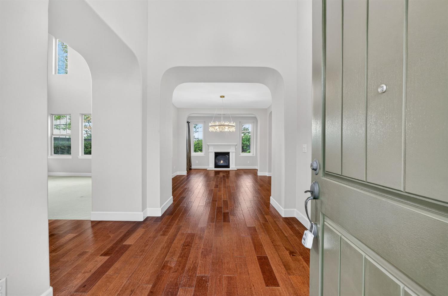 2050 Impressionist Way El Dorado Hills, CA 95762 - Photo 13 of 83 a view of a hallway with wooden floor and staircase