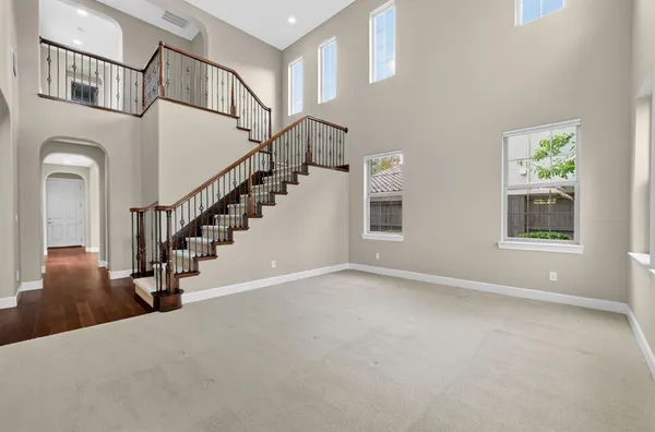 a kitchen with stainless steel appliances granite countertop a stove and a refrigerator