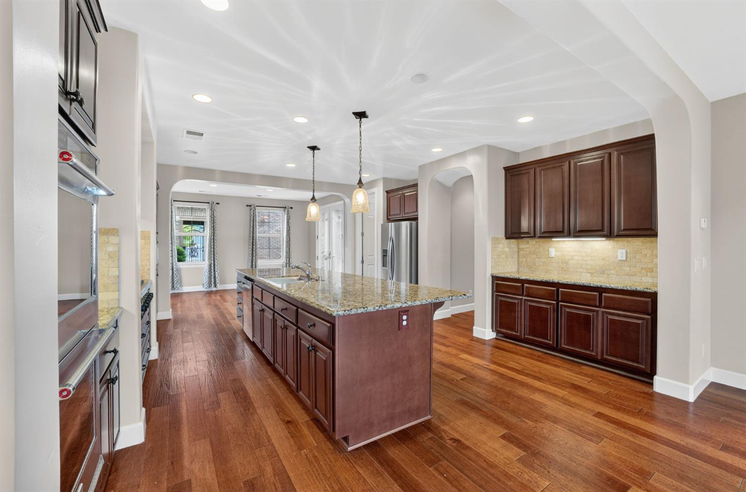 2050 Impressionist Way El Dorado Hills, CA 95762 - Photo 27 of 83 a kitchen with stainless steel appliances granite countertop a stove and a refrigerator