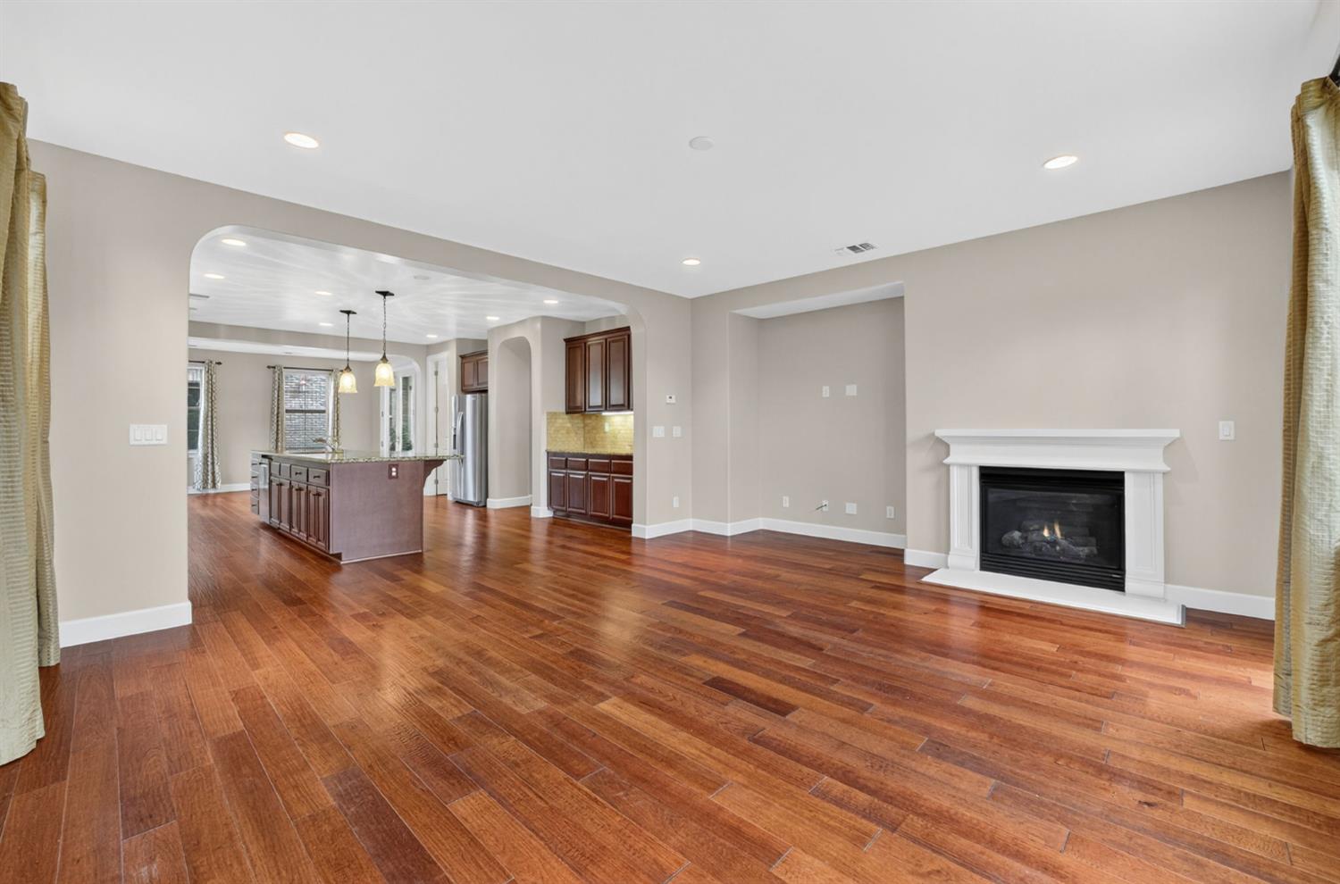 2050 Impressionist Way El Dorado Hills, CA 95762 - Photo 29 of 83 a view of a livingroom with wooden floor and a kitchen
