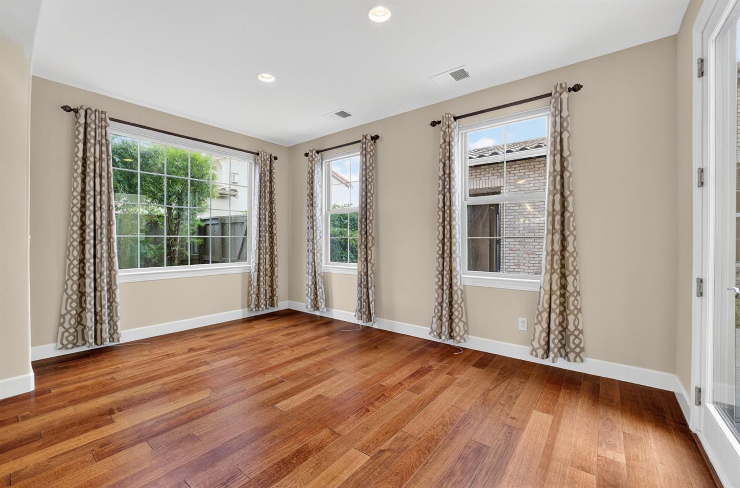 2050 Impressionist Way El Dorado Hills, CA 95762 - Photo 33 of 83 a view of an empty room with wooden floor and a window