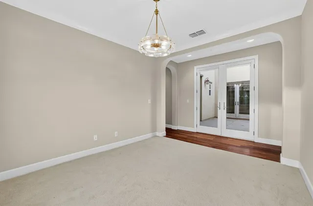a view of storage and utility room with wooden floor
