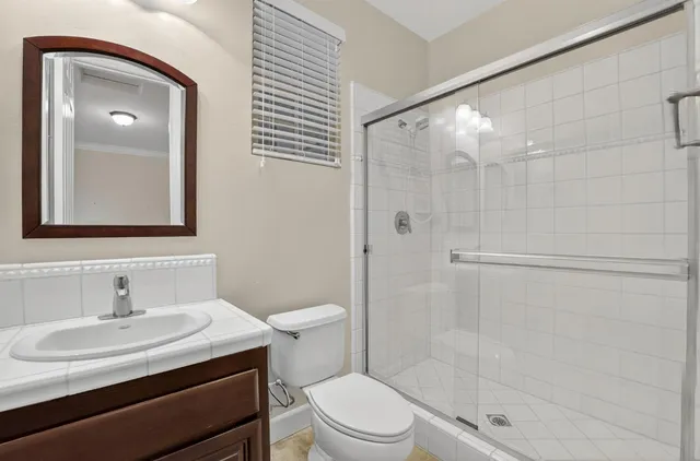 a bathroom with a sink double vanity and a mirror