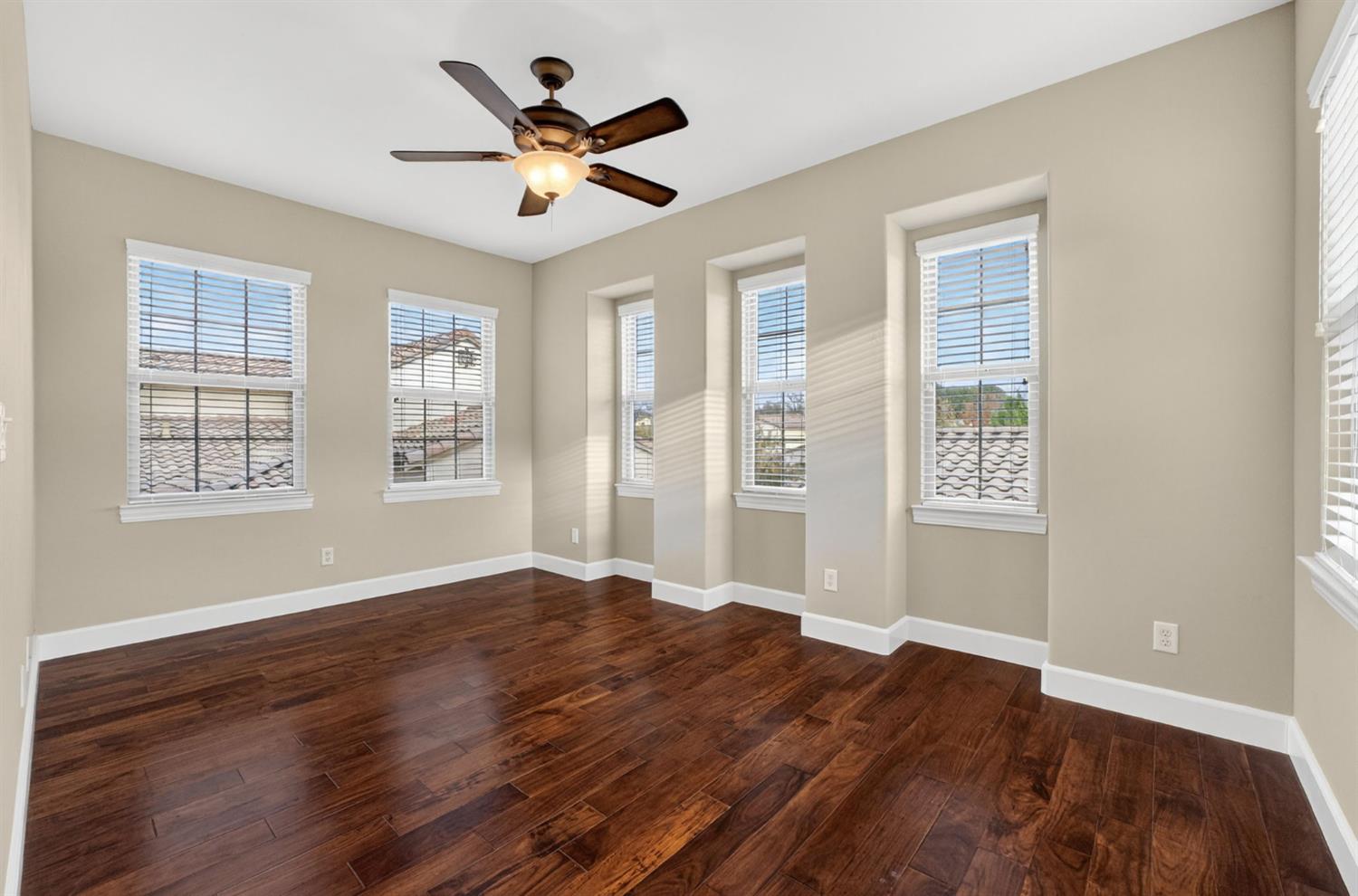 2050 Impressionist Way El Dorado Hills, CA 95762 - Photo 55 of 83 a view of empty room with wooden floor and fan