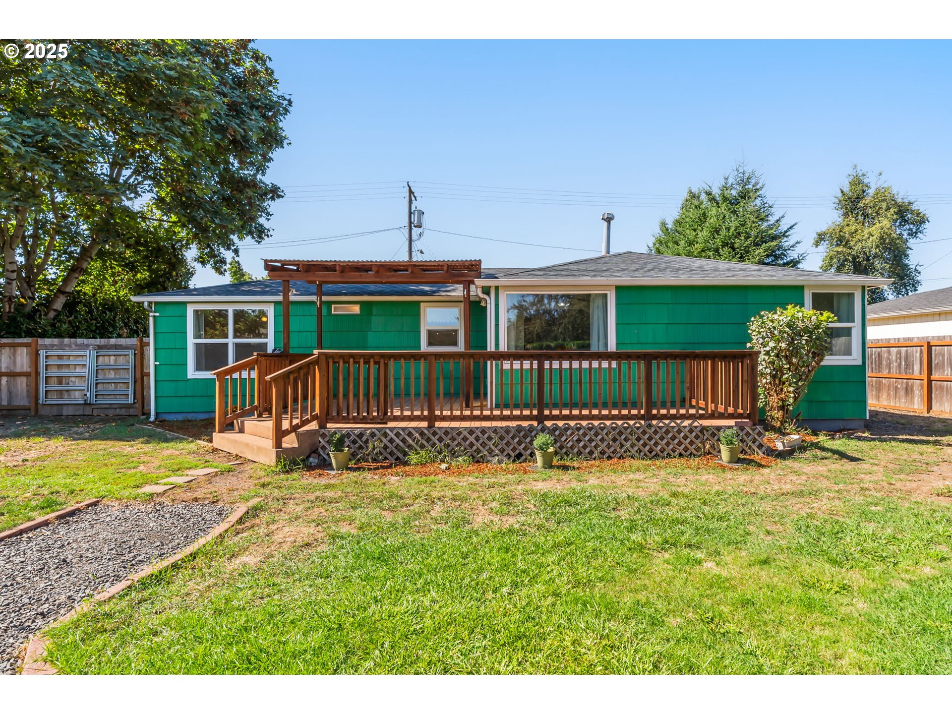 1025 54th Street Springfield, OR 97478 - Photo 20 of 31 a view of a house with a yard and sitting area