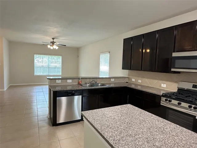 a kitchen with a stove and a sink