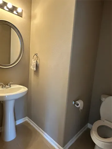 a bathroom with a sink and a toilet