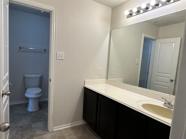 a bathroom with a toilet and a bathtub