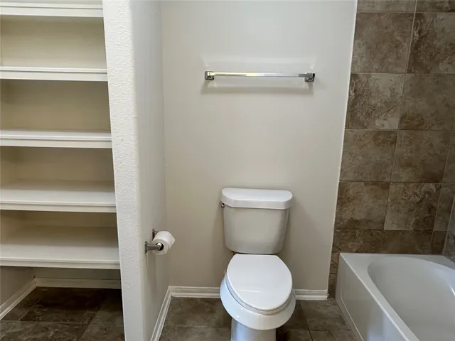 a bathroom with a sink a toilet and vanity