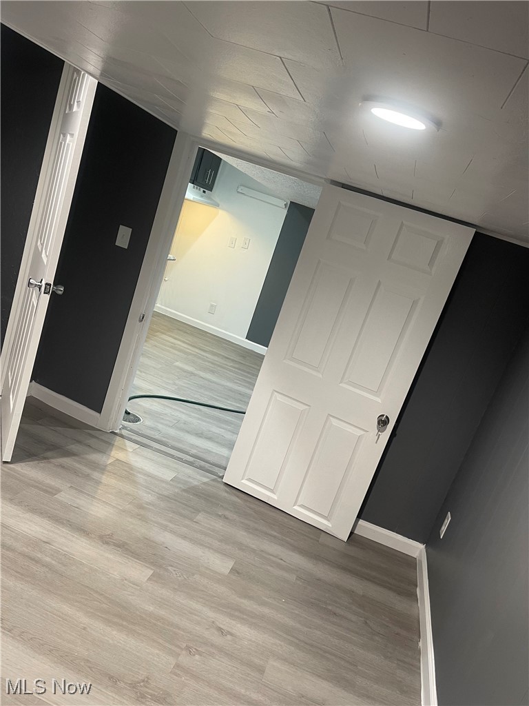 603 Liberty Road Youngstown, OH 44505 - Photo 26 of 42 Hall with light wood-style floors and baseboards