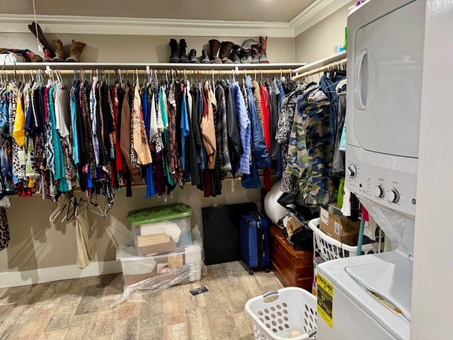 59 Private Road Dayton, TX 77535 - Photo 12 of 13 a view of walk in closet with clothes and shoes