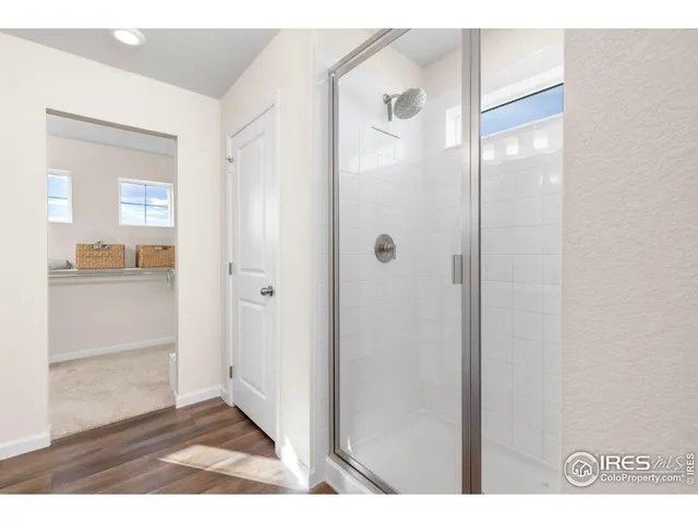 a view of a bathroom from a hallway