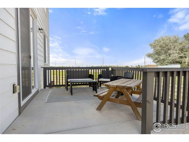 a terrace with outdoor seating and city view