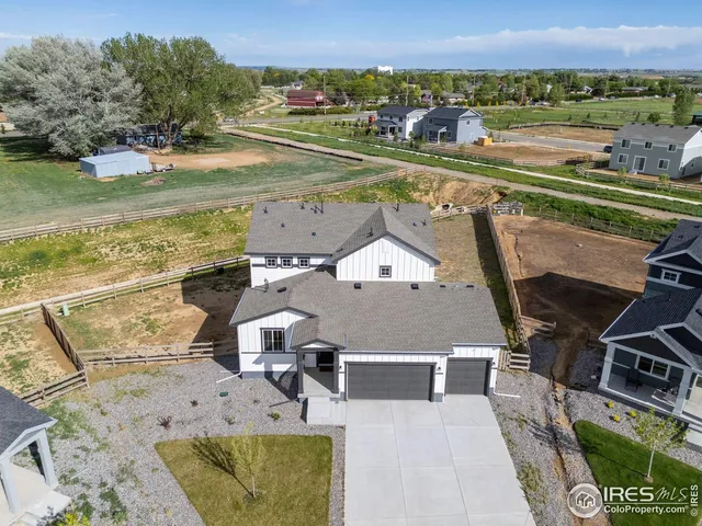 an aerial view of a house with a ocean view
