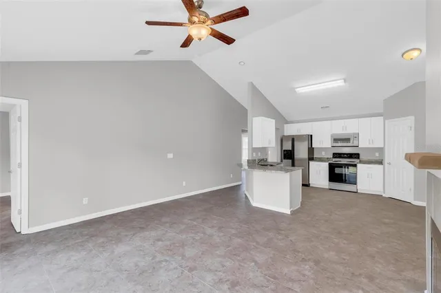 a view of a kitchen with furniture and a window