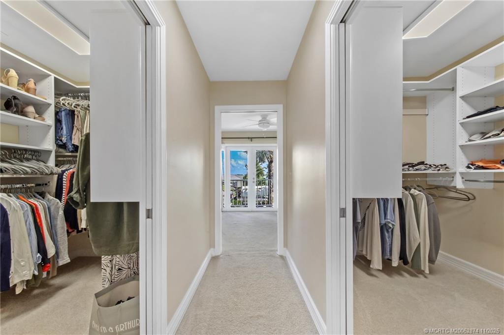 7 Island Road Stuart, FL 34996 - Photo 28 of 67 a view of walk in closet with clothes