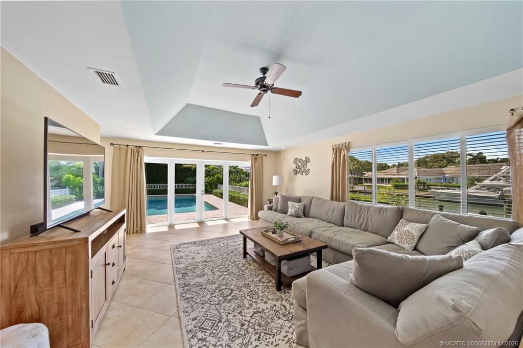 7 Island Road Stuart, FL 34996 - Photo 31 of 67 a living room with furniture and a flat screen tv