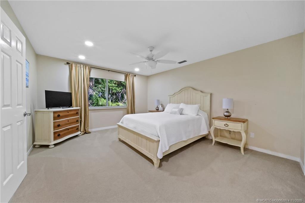 7 Island Road Stuart, FL 34996 - Photo 34 of 67 a bed room with a bed and a television