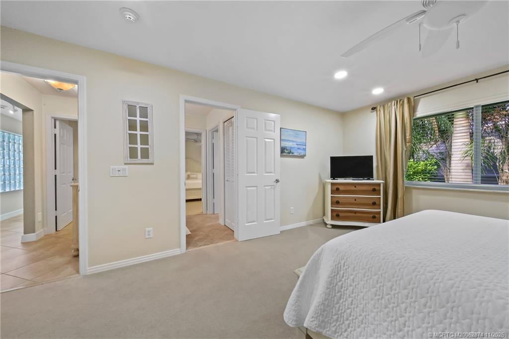 7 Island Road Stuart, FL 34996 - Photo 35 of 67 a bedroom with a bed and a flat screen tv