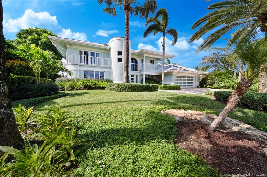 7 Island Road Stuart, FL 34996 - Photo 4 of 67 a view of a building with a garden