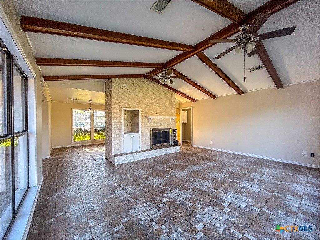 902 Joplin Street Victoria, TX 77904 - Photo 14 of 43 a view of empty room with a fireplace and windows