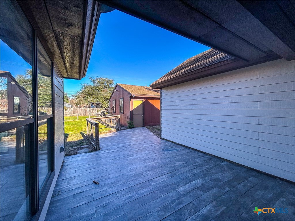 902 Joplin Street Victoria, TX 77904 - Photo 31 of 43 a view of a porch with wooden floor and a yard