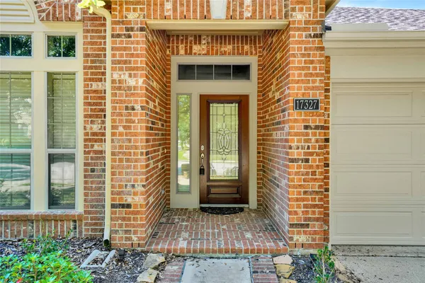 a open kitchen with stainless steel appliances granite countertop a stove and a refrigerator