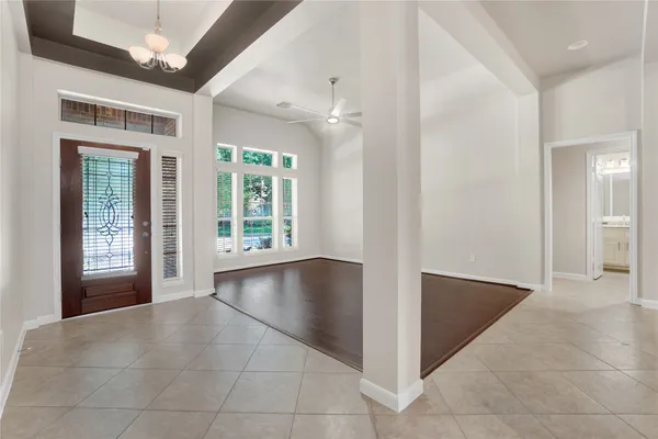 a kitchen with refrigerator and microwave