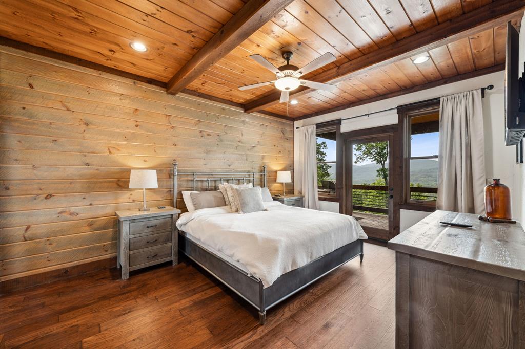 370 High Ridge Road Epworth, GA 30541 - Photo 25 of 61 a bedroom with a large bed and a large window